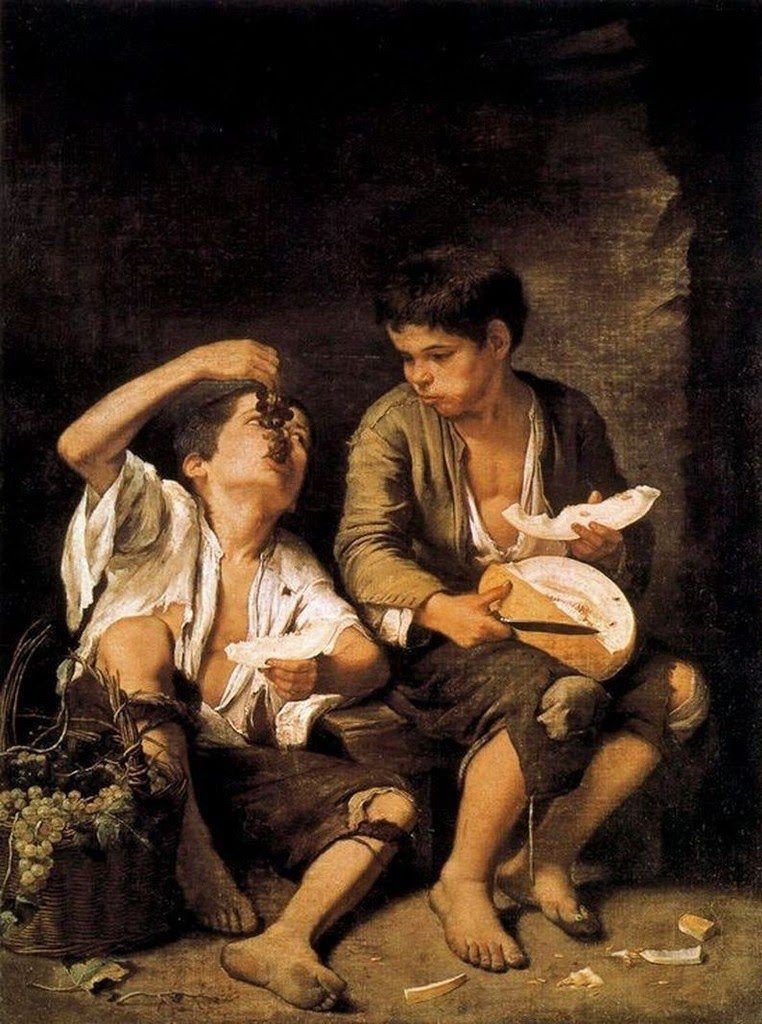 Niños comiendo uvas y melón